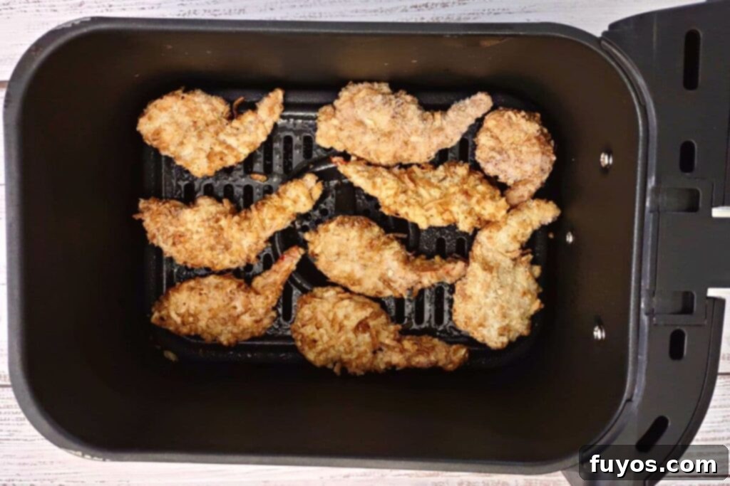add frozen coconut shrimp to air fryer basket