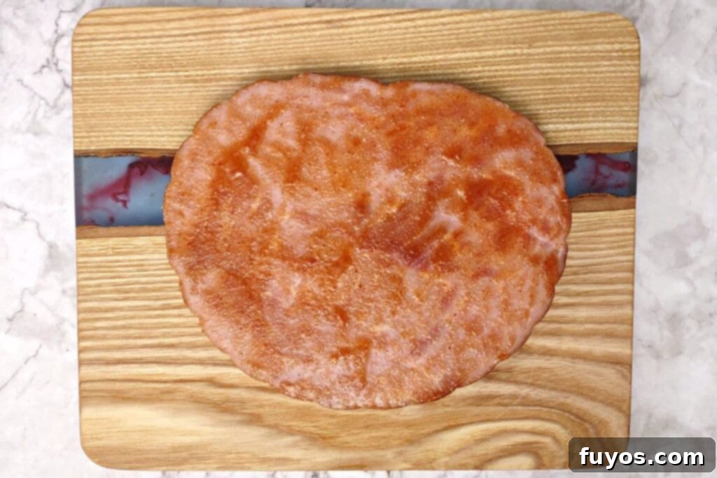 Spread glaze on ham steak before air frying
