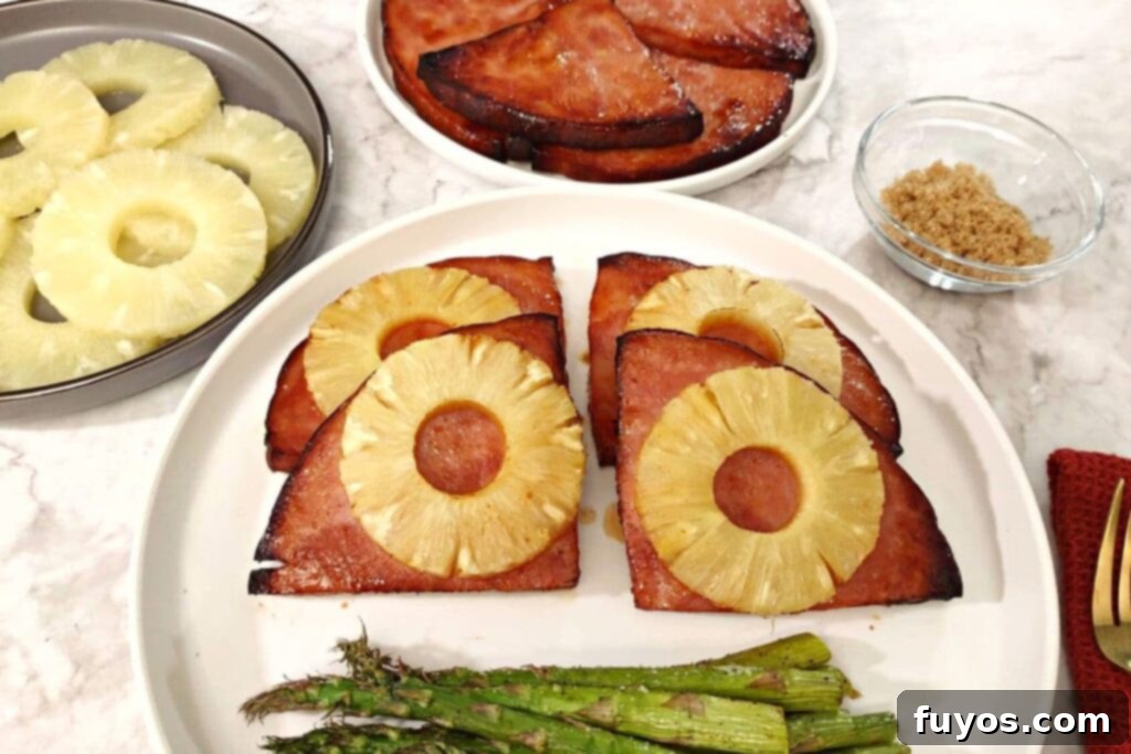 Air Fryer Ham Steak served with pineapple and asparagus