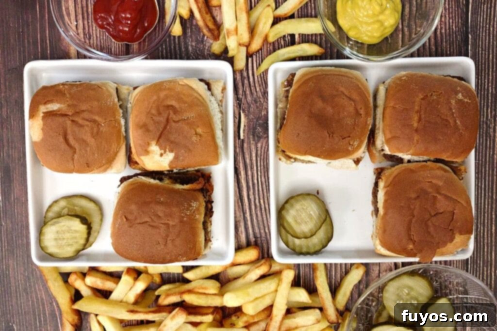 Quick and Easy Air Fried White Castle Sliders From Frozen 9 Overhead view of perfectly air-fried White Castle sliders served on square plates with pickle slices and golden fries