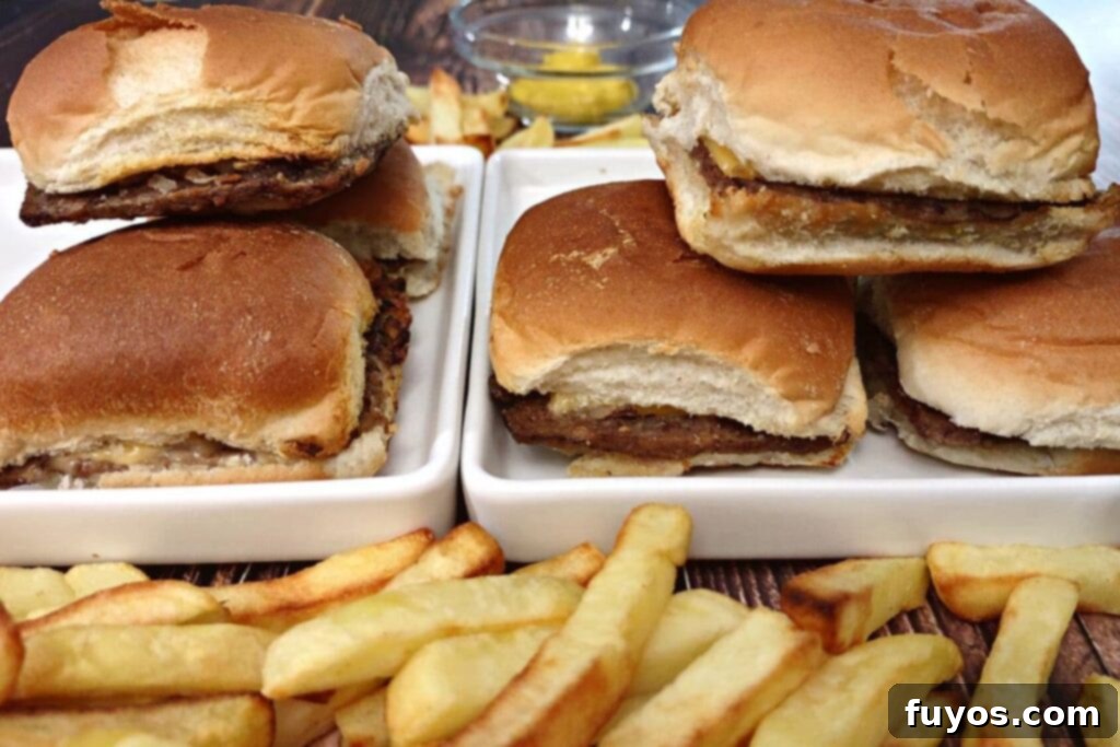 Quick and Easy Air Fried White Castle Sliders From Frozen 10 Air-fried White Castle sliders neatly stacked on two plates, ready to be served