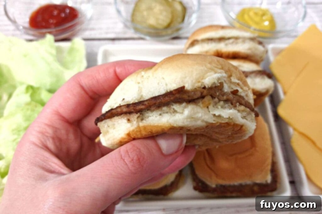 From Freezer to Feast Microwave White Castle Burgers 3 holding a white castle burger slider heated up in the microwave