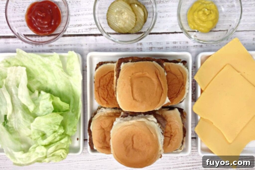 From Freezer to Feast Microwave White Castle Burgers 9 overhead view of white castle sliders on a plate with lettuce, cheese, and condiments surrounding