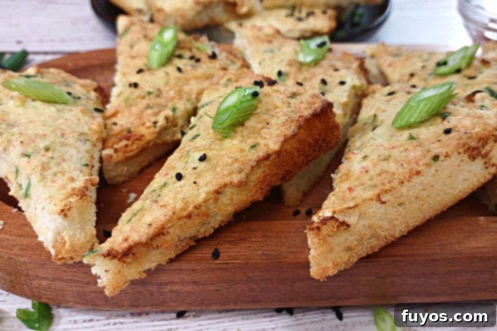 close up of shrimp toast on a wooden platter cut diagonally