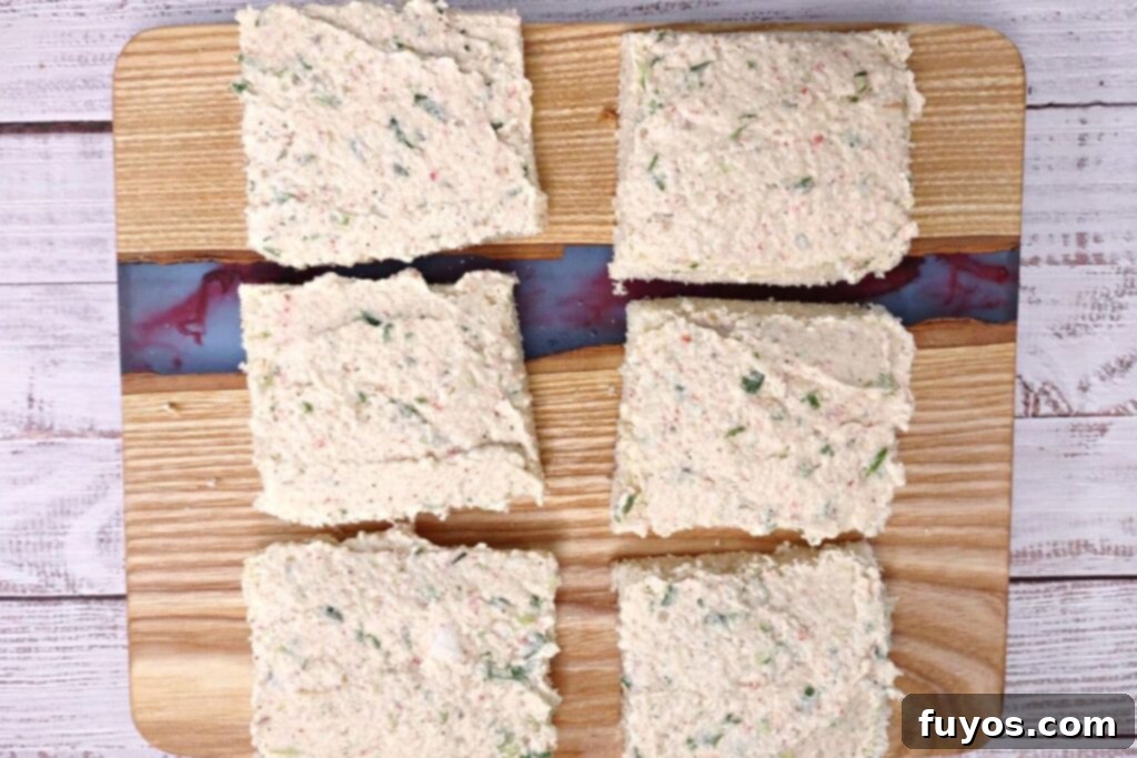 spread shrimp and crab mixture over bread