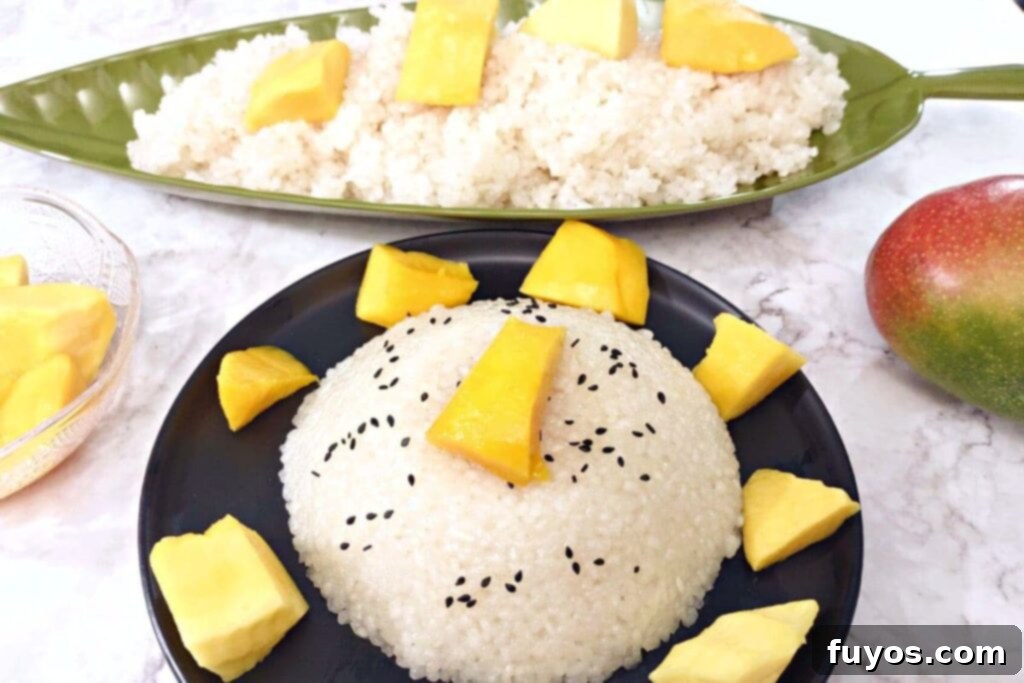 Effortless Microwave Coconut Mango Sticky Rice 10 microwave sticky rice in a dome surrounded by mango chunks