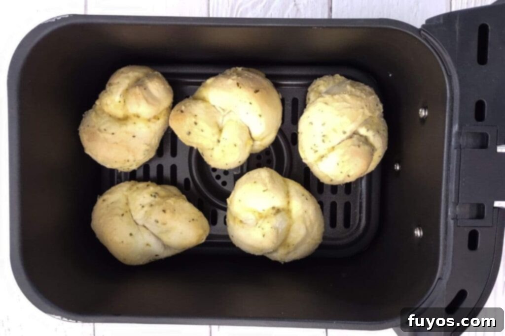 Crispy Air Fryer Frozen Garlic Knots in Under 10 Minutes 5 Frozen garlic knots neatly placed in a single layer inside an air fryer basket
