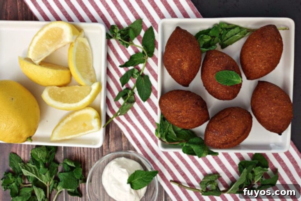 Trader Joe's Kibbeh Air Fryer Magic: Effortless Middle Eastern Flavor 6 Overhead view of perfectly air fried Trader Joe's kibbeh on a plate with lemon wedges