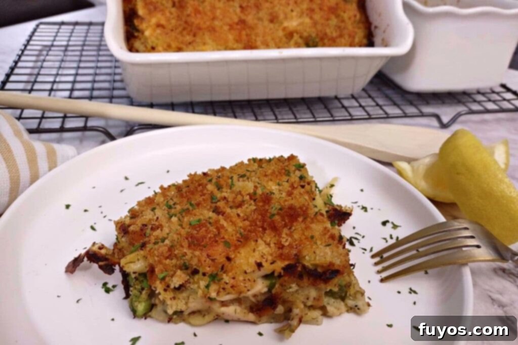 Air Fryer Tuna Casserole Your Perfect Comfort Indulgence 12 A serving of creamy air fryer tuna casserole on a white plate with a fork.