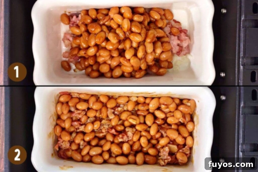 Adding coated baked beans to the cooked bacon and onion mixture in the air fryer basket