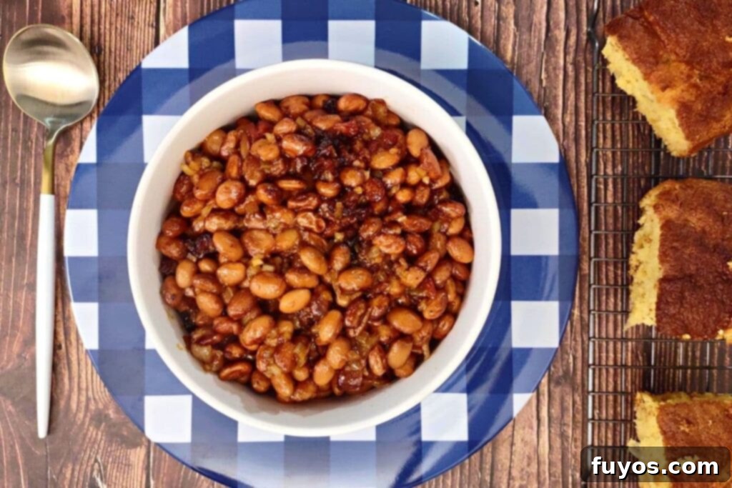 Overhead view of air fryer BBQ baked beans with bacon, ready to enjoy