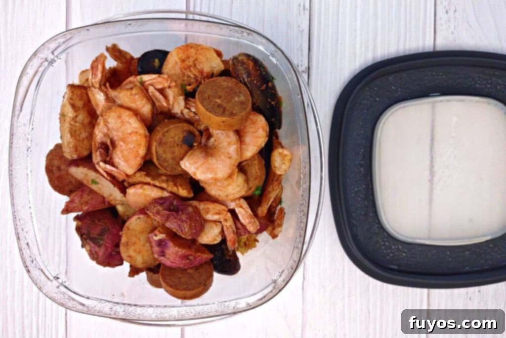 Microwave Your Seafood Boil Perfectly Every Time 4 leftover seafood boil from the fridge in a container