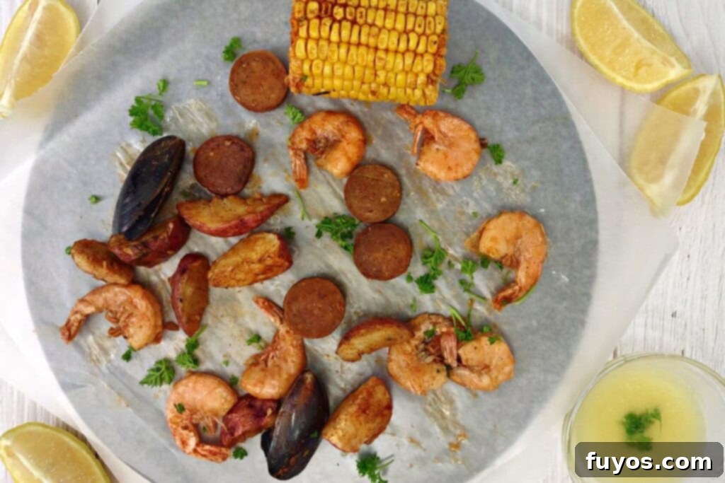 Microwave Your Seafood Boil Perfectly Every Time 9 overhead view of reheated seafood boil on a plate
