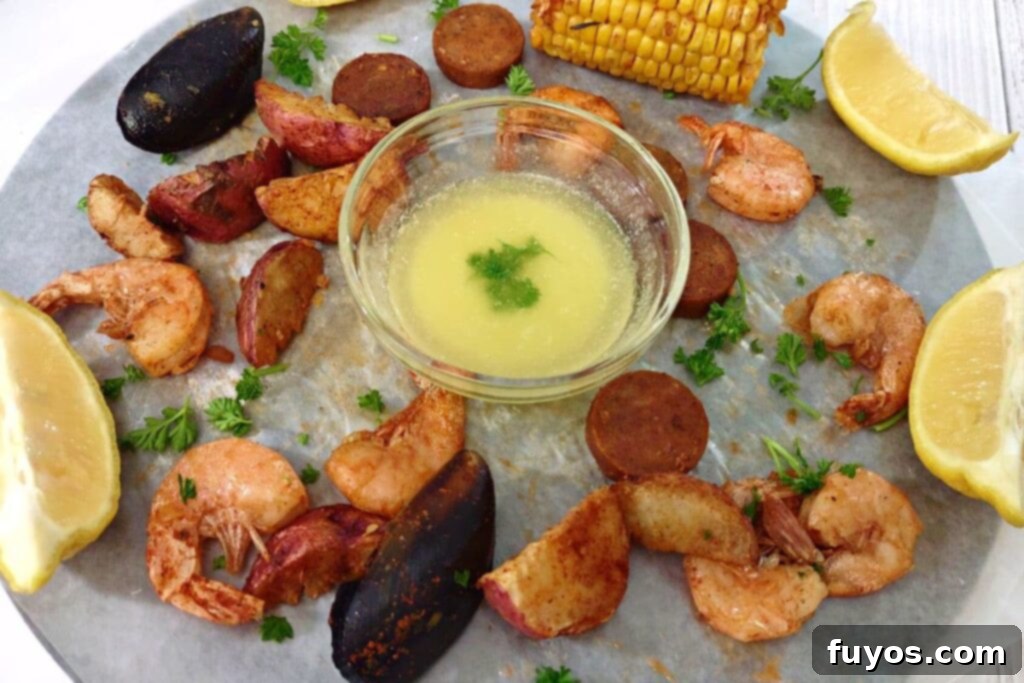 Microwave Your Seafood Boil Perfectly Every Time 10 reheated seafood boil from the microwave spread out around melted butter