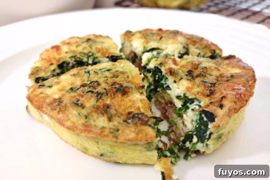 crustless steak and spinach mini quiche on a plate cut into quarters