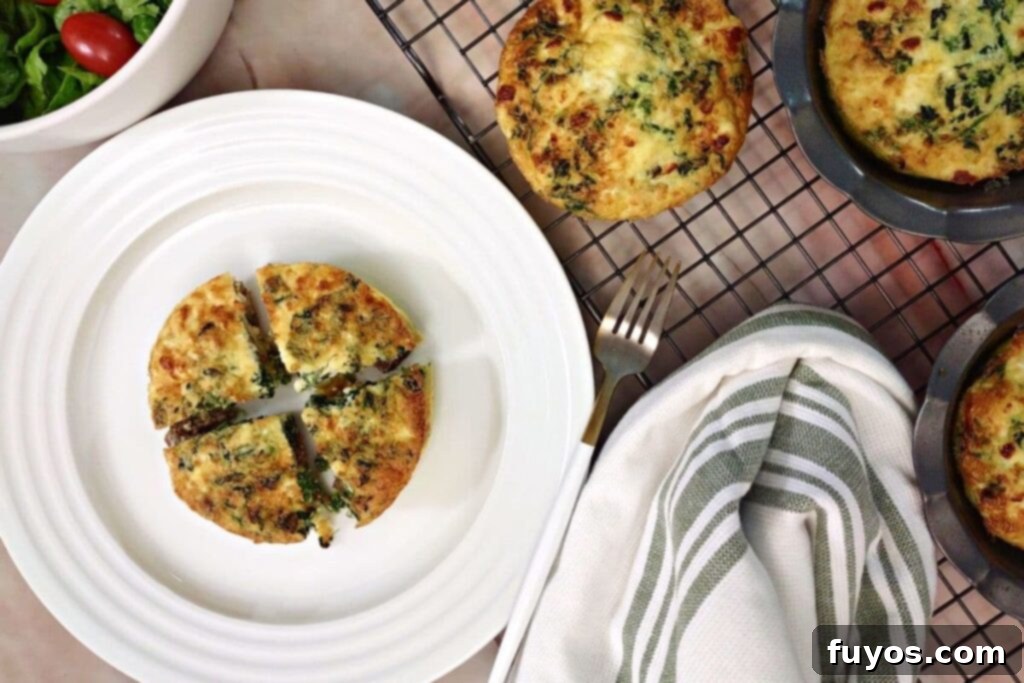 overhead view of crustless mini steak and spinach quiche on a plate
