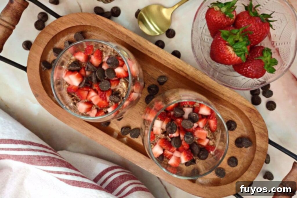 overhead view of two glasses of chocolate strawberry overnight oats