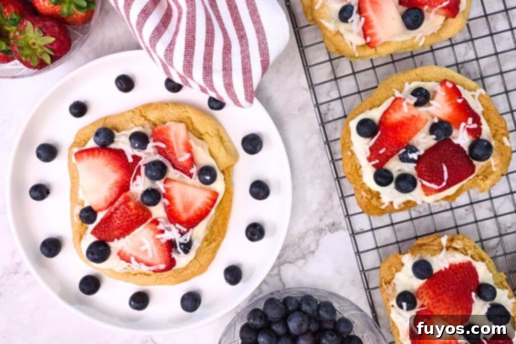 overhead view of air fryer sugar cookie fruit-pizza with fresh blueberry and strawberry