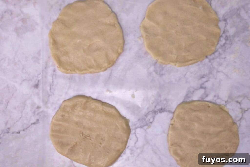 press cookie dough down into appropriate shape