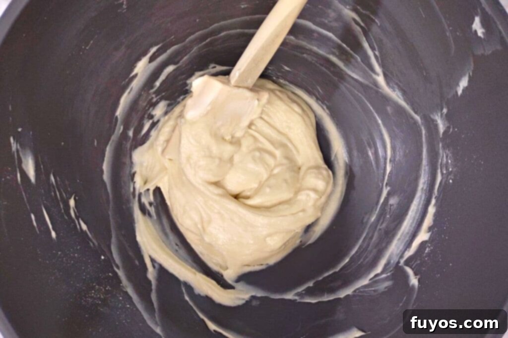 combine cream cheese, powdered sugar, and vanilla extract in a bowl