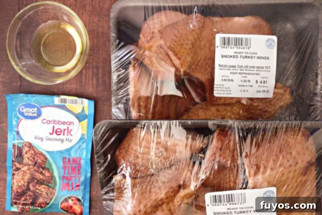 Ingredients for making smoked turkey wings in the air fryer, including wings, olive oil, and seasoning