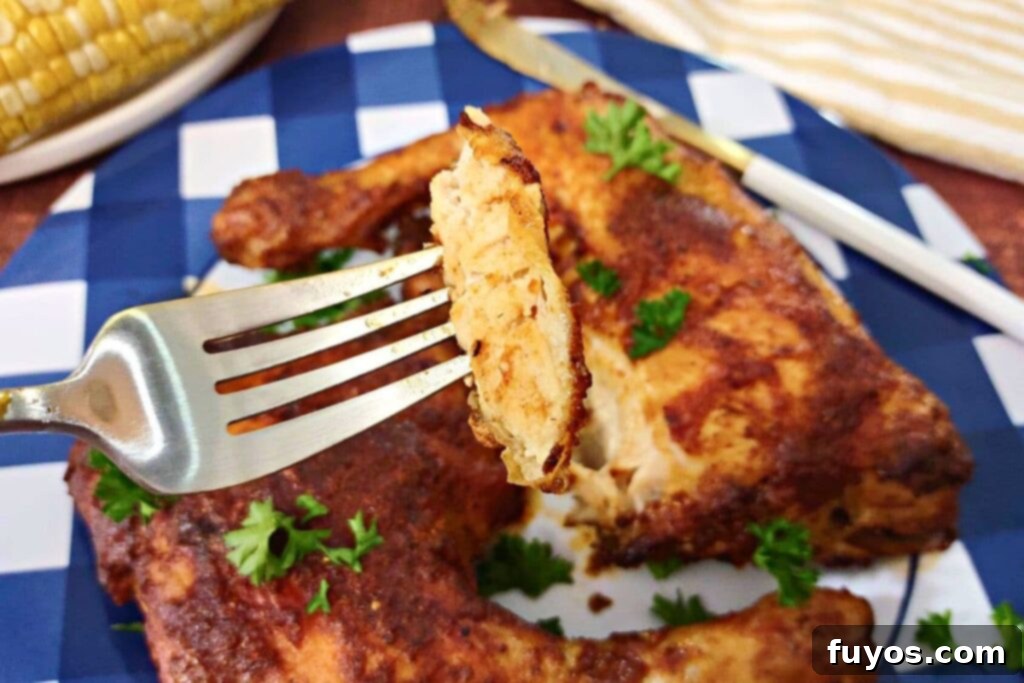 Deliciously Fast Air Fryer BBQ Chicken Leg Quarters 3 piece of air fryer bbq chicken on a fork