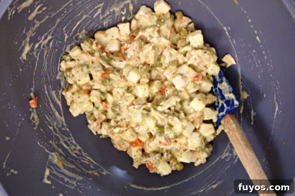 Air Fryer Chicken Pot Pie Forget the Oven 6 in a bowl mix carrots, peas, chicken, soup, and seasonings