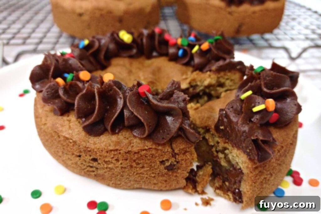 A freshly baked air fryer cookie cake on a wire rack, cooling down