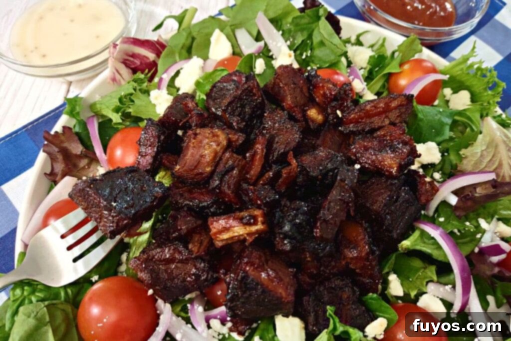 Rapid Air Fryer Burnt Ends: Tender Brisket Bliss 3 air fryer burnt ends salad with a fork
