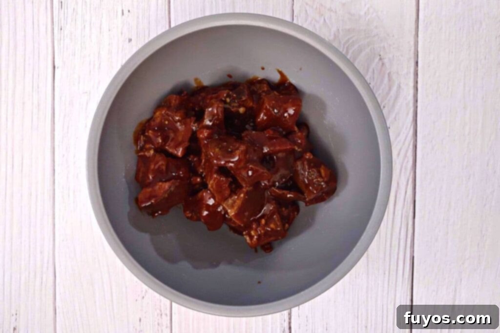 Rapid Air Fryer Burnt Ends: Tender Brisket Bliss 5 toss burnt ends in barbecue sauce