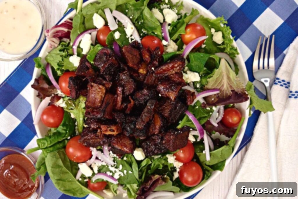 Rapid Air Fryer Burnt Ends: Tender Brisket Bliss 7 overhead view of brisket burnt ends on a salad