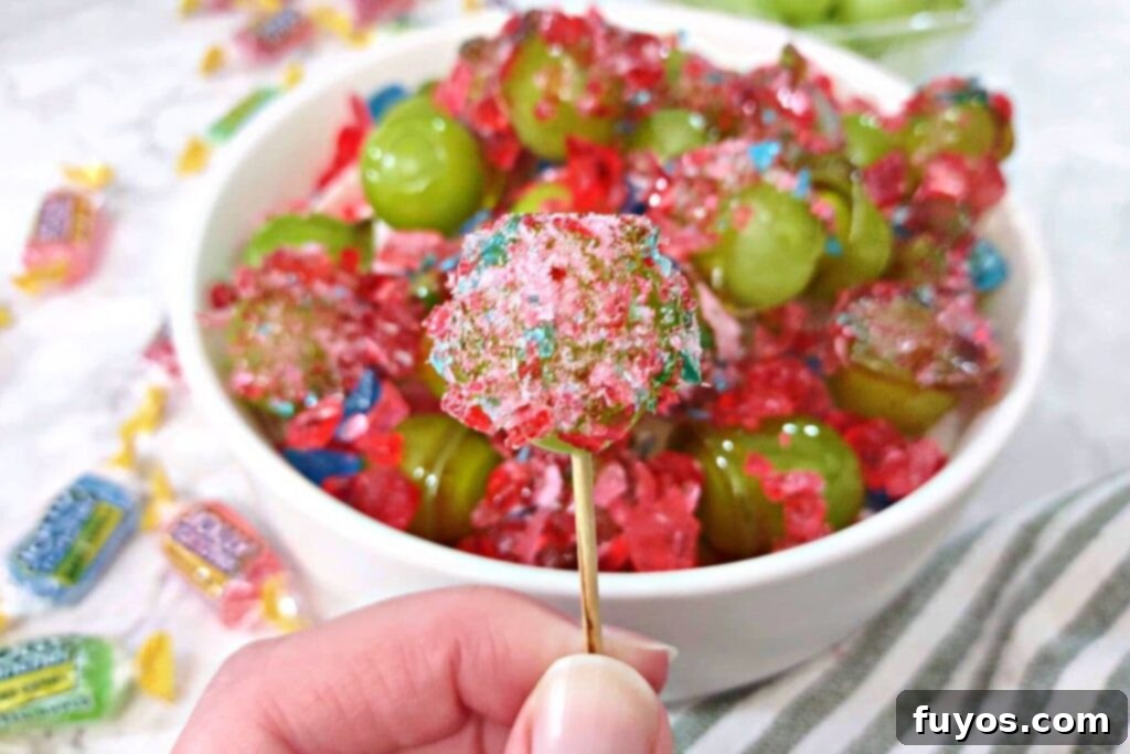 holding up a finished jolly rancher grape on a toothpick
