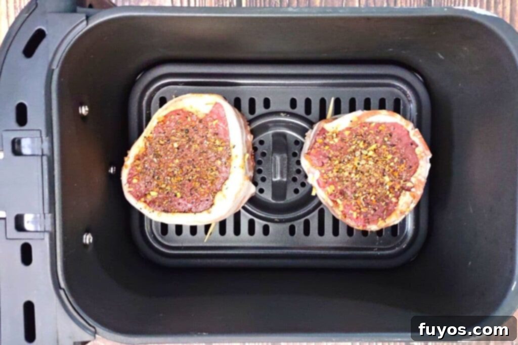 place bacon wrapped filet in air fryer basket