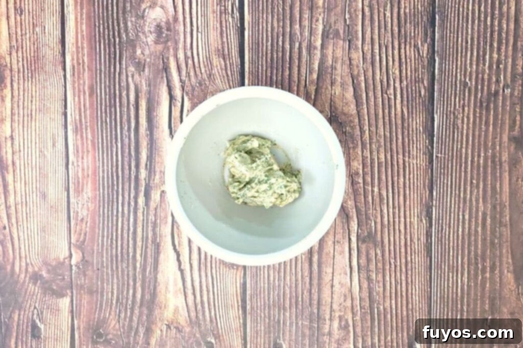 combine softened butter and seasoning in a small bowl
