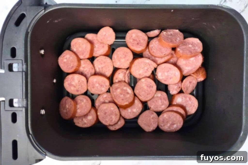Perfect Smoked Sausage in Your Air Fryer 6 place smoked sausage slices in air fryer basket
