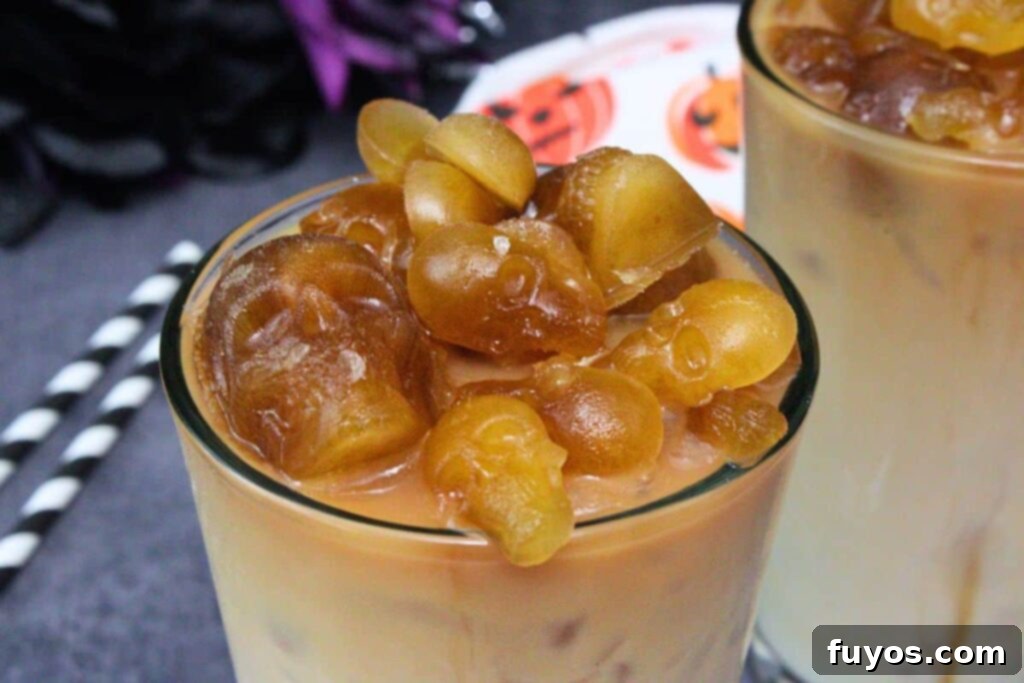 Halloween's Dearly Depar-tead Brown Sugar Skull Milk Tea 3 closeup view of skull milk tea showing brown sugar skull ice in drink