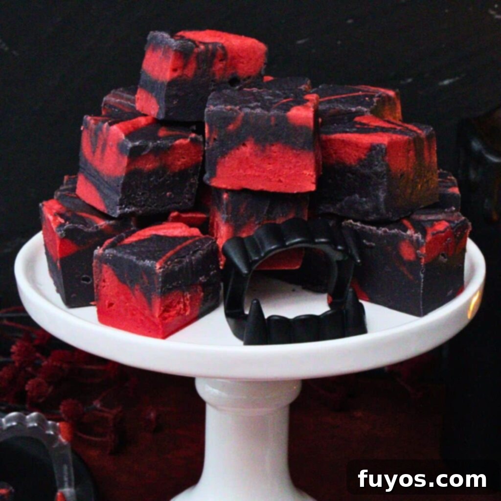 Vampire Fudge: A Sinfully Simple Halloween Indulgence 2 Vibrant red and black swirled vampire fudge squares, perfectly showcasing the dramatic Halloween theme, ready for a spooky party spread.
