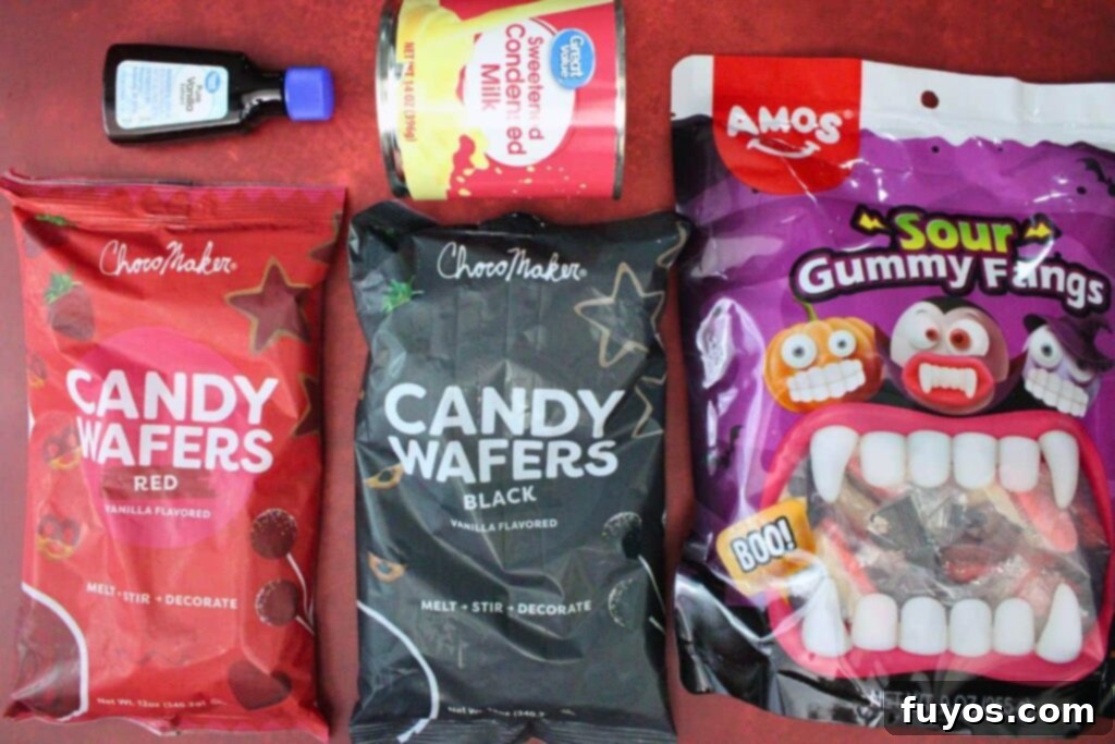 Vampire Fudge: A Sinfully Simple Halloween Indulgence 4 A flat lay of ingredients laid out to make vampire fudge, including black and red candy melts, sweetened condensed milk, and vanilla extract.