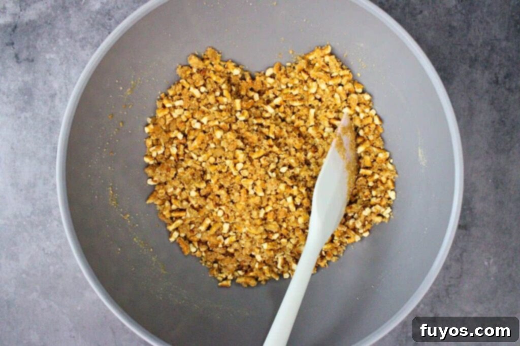 add crushed pretzels to melted butter and sugar