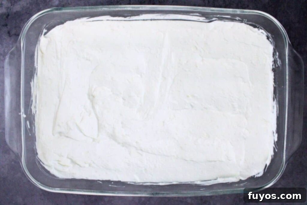 add cream cheese mixture on top of crushed pretzels