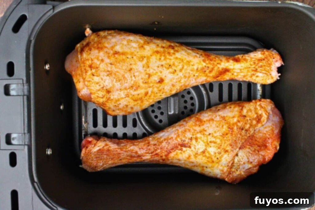 place seasoned turkey legs in air fryer basket