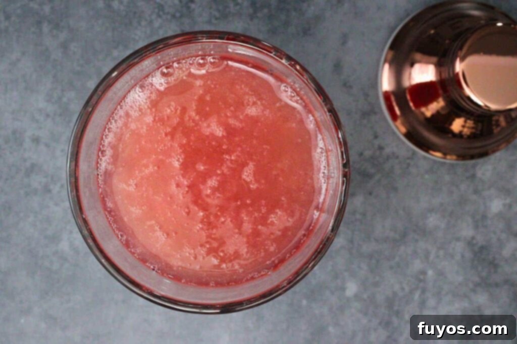 combine vodka, cranberry juice, lemon juice, simple syrup, and egg white in cocktail shaker