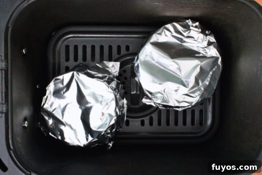 place foil covered pumpkins or ramekins in air fryer basket