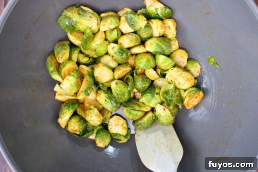 mix brussel sprouts with melted butter and seasoning