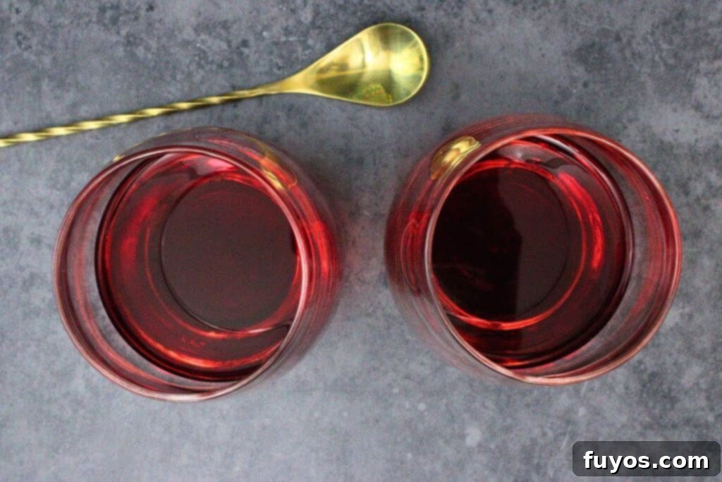 add cranberry juice and vodka to lowball style glass