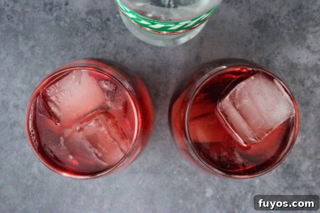 add ice to cranberry and vodka then top with sprite