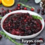 Microwave cranberry sauce recipe, a vibrant red, glossy sauce in a bowl, perfect for holiday dinners, easy to make