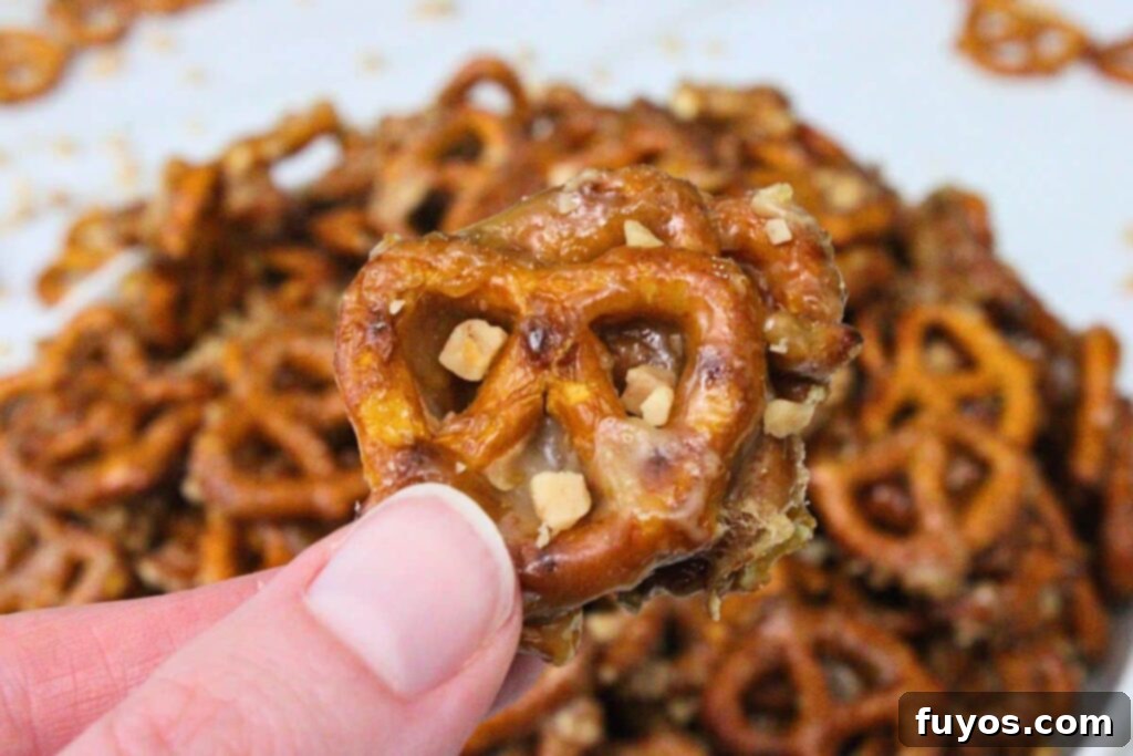 holding up a butter toffee pretzel showing off the color and texture