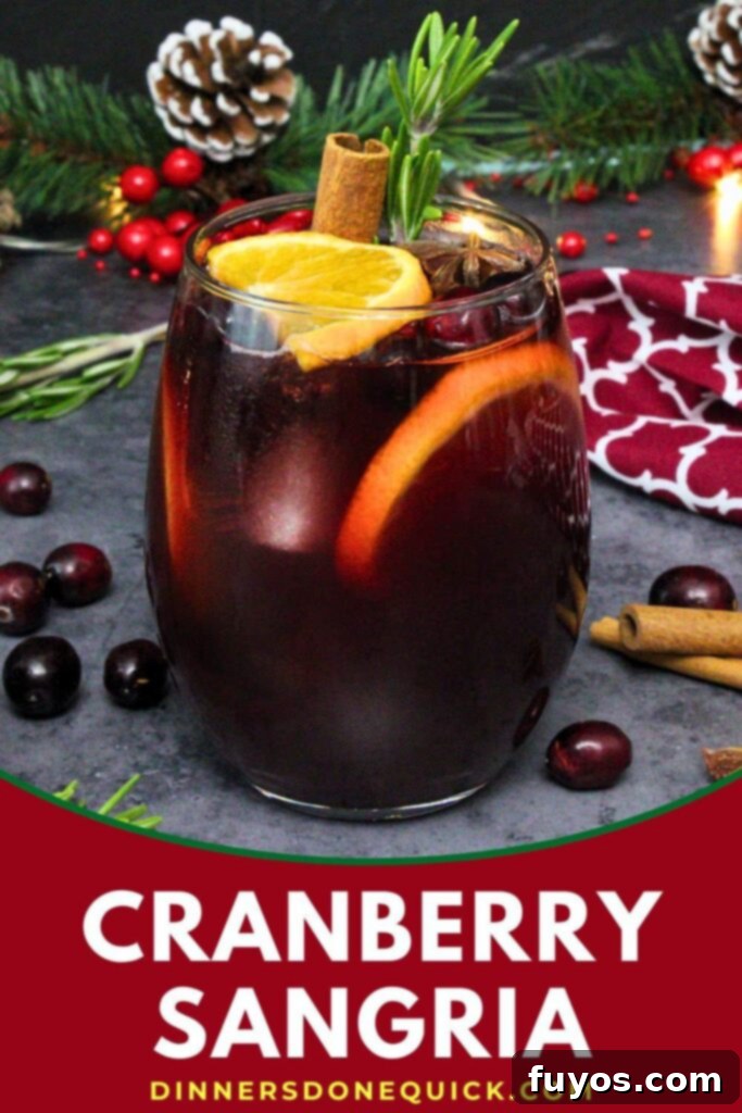 A festive image for Pinterest featuring cranberry sangria, ideal for holiday entertaining and easy recipe discovery.