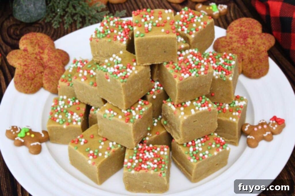 Effortless Holiday Gingerbread Fudge 9 plate of gingerbread fudge squares topped with sprinkles with gingerbread cookies to the side